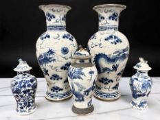 A pair of Chinese blue and white crackle glazed baluster vases depicting a five-clawed dragon