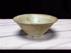 A Chinese Longquan olive green glazed earthenware bowl, Song dynasty, diameter 12 cm.
