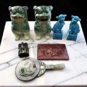 A pair of Chinese green glazed earthenware foo dogs, 20th century, height 19 cm,