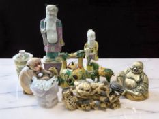 A group of Chinese and Japanese decorative objects including earthenware figures of elders,