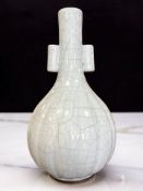 A Chinese Guan-type arrow vase, the lobed slender neck widening to a bulbous lower body,