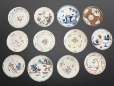 Twelve Chinese porcelain saucer dishes, 18th century and later, largest diameter 13.5 cm.