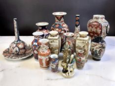 A collection of Japanese Imari, Satsuma and Kutani pottery including various vases, figures,