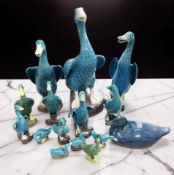 A group of Chinese mainly turquoise glaze porcelain ducks, 20th century, tallest 25 cm.