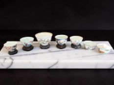 A Chinese famille rose porcelain tea bowl, hand painted in enamels with crabs amongst foliage,