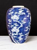 A Chinese blue and white porcelain vase decorated with prunus blossom on cracked ice ground,