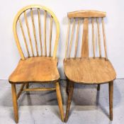 A 20th century Ercol elm spindleback chair, together with another.