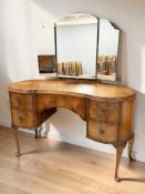A mid-20th century figured walnut kidney shaped mirror back dressing chest, width 125 cm.
