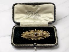A Victorian 9ct gold garnet and split pearl brooch, width 4.5cm CONDITION REPORT: 3.