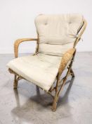 A Scandinavian bentwood and wicker armchair, width 68 cm.