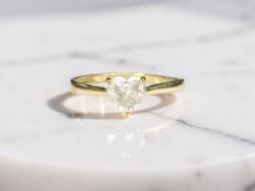 A 9ct gold solitaire dress ring with heart-cut cubic zirconia,