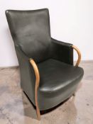 A Scandinavian bentwood and black leather armchair, width 60 cm.