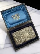 A Victorian/Edward VII embossed silver card case, Samuel M Levi, Birmingham 1901, length 8.