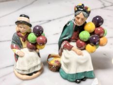 A Royal Doulton figure 'The Old Balloon Seller' HN1315, together with 'Balloon Girl' HN2818.