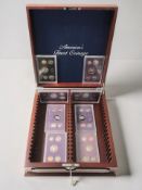 An America's Finest Coinage coin collector's box with key containing eight various proof sets.