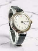 A vintage lady's silver-cased wristwatch, London import mark for 1910,