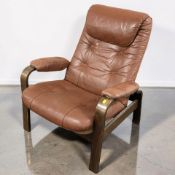 A 20th century Scandinavian bentwood lounge armchair, upholstered in dark tan leather, width 78 cm.