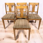 A set of four 20th century continental satinwood dining chairs.