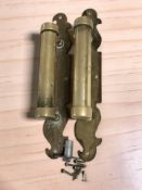 A pair of early 20th century brass door pull handles, overall length 40 cm.