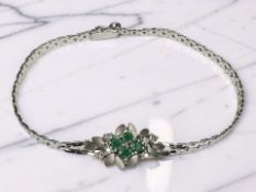 An 18ct white gold emerald and diamond bracelet, length 17.5cm CONDITION REPORT: 6.