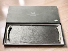 A contemporary slate serving platter in box, width 43 cm.