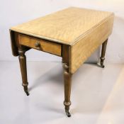 A Victorian satinwood drop leaf sofa table, length 106 cm.