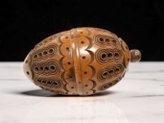 A treen carved coquila nut pomander, length 7.