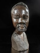 An African carved hardwood bust of a man, height 42 cm.