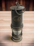 A Patterson Lamps Gateshead on Tyne brass and steel miner's safety lamp.