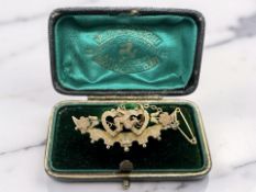 A Victorian 9ct gold crescent bar brooch with the Isle of Man coat of arms, width 4cm.
