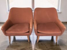 A pair of 20th century Scandinavian armchairs in burgundy fabric, width 70 cm.