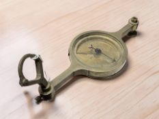 A brass ship's compass signed 'W & S Jones, London', overall width 30 cm.