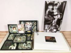 A group of Elvis Presley framed collectible vinyl records and CDs, large canvas picture, etc.