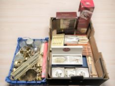 Several cases of cutlery, drinking glasses, brass candlesticks and candles,