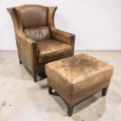A 20th century chestnut brown studded leather wingback armchair, width 82 cm.