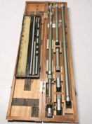 A Japanese Mitutoyo micrometer gauge in teak case measuring 116 cm long,