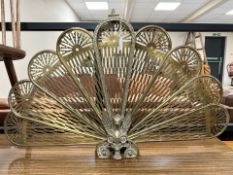 A brass 'peacock' fire screen, height 57 cm.