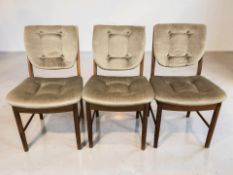 A 20th century G-Plan teak circular extending dining table with internal leaf,