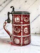 A Bohemian etched and ruby flash-cut tankard with pewter mounts, 19th century, height 16cm.
