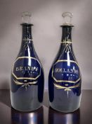 A pair of Bristol blue glass decanters, circa 1780, with gilt labels for Brandy and Hollands,