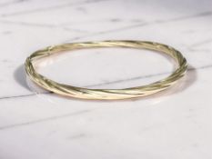 A gold bangle, apparently unmarked, inner width 6.5cm CONDITION REPORT: 4.