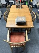 A 20th century teak extending dining table with internal leaf, unextended 152 cm x 86 cm x 76 cm,
