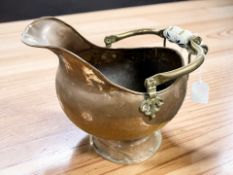 A Victorian copper coal helmet, height 30 cm.