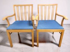 A pair of 20th century Scandinavian beech armchairs.