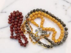 A group of amber and other bead necklaces