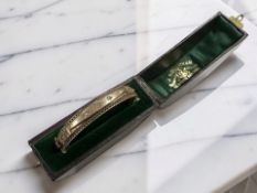 A Victorian 9ct gold diamond-set hinged bangle, inner width 5.