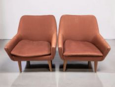 A pair of 20th century Scandinavian armchairs in burgundy fabric, width 70 cm.