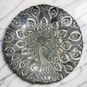 A contemporary carnival glass style charger / fruit bowl depicting a peacock, diameter 40 cm.