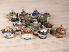 A collection of Japanese earthenware koros, tallest 11 cm.