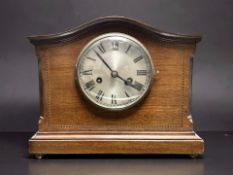 An early 20th century inlaid mahogany eight day mantel clock, height 27 cm.